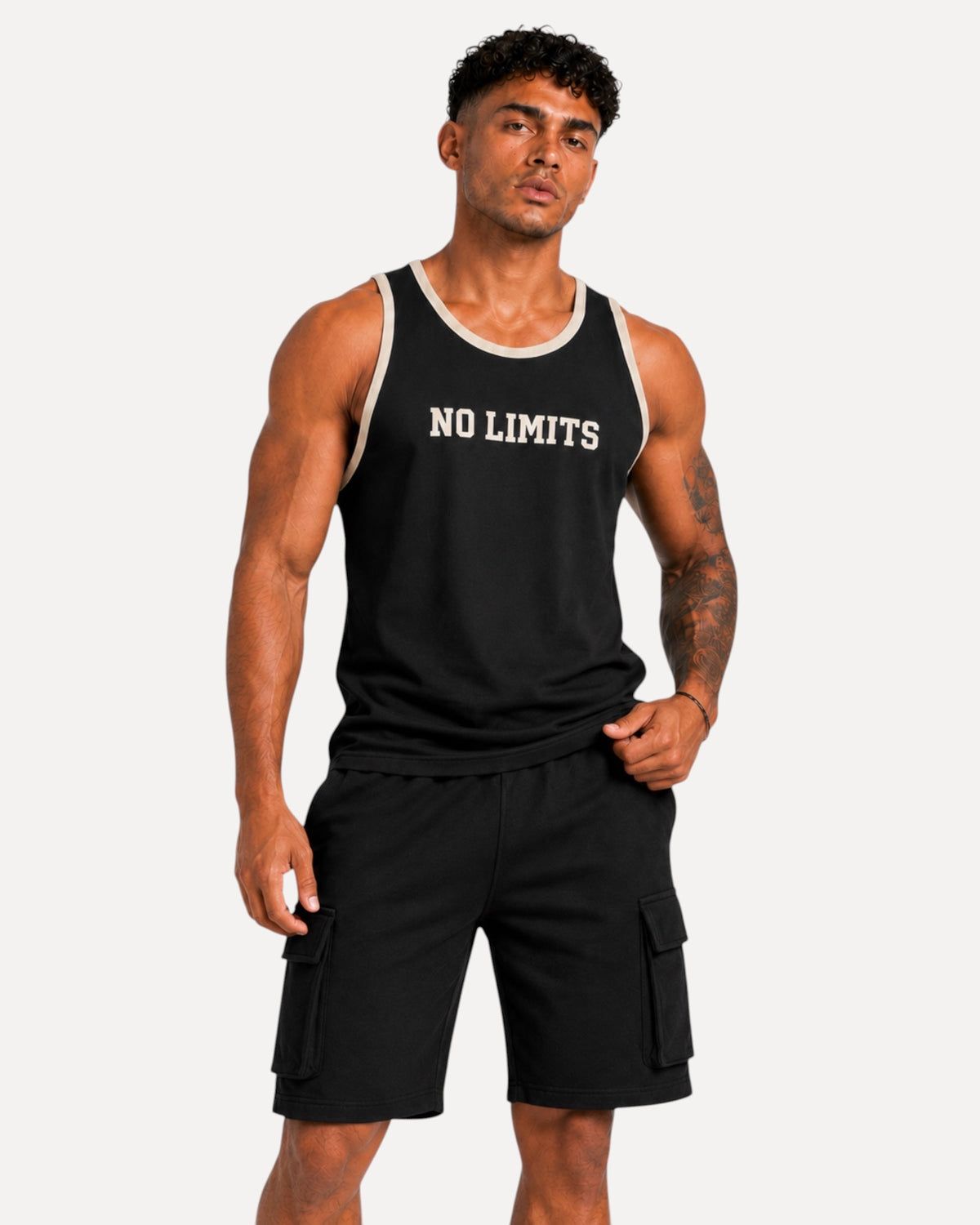 My Store ATHLEX black sleeveless tank top with NO LIMITS print and contrast trim worn by a muscular man.