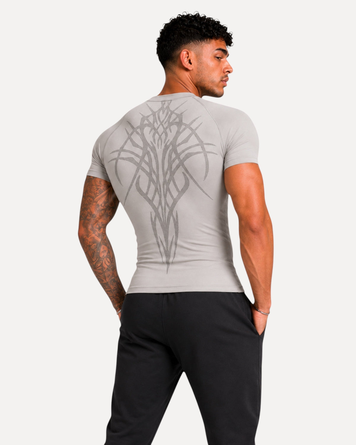 My Store ATHLEX Glory light grey compression shirt with tonal back graphic on a muscular model, back view