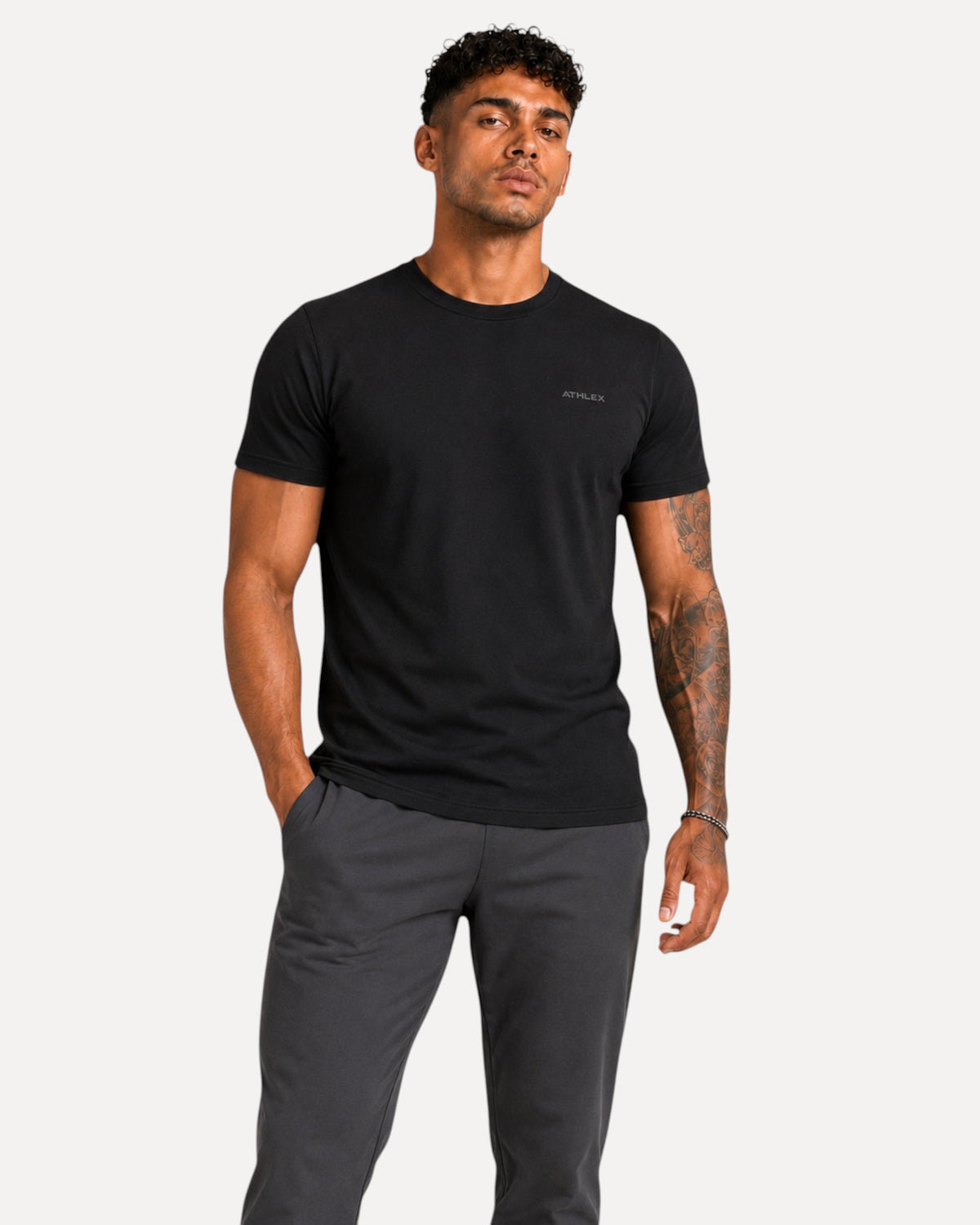 My Store ATHLEX men's minimal black cotton jersey t-shirt with chest logo worn by a model with athletic fit