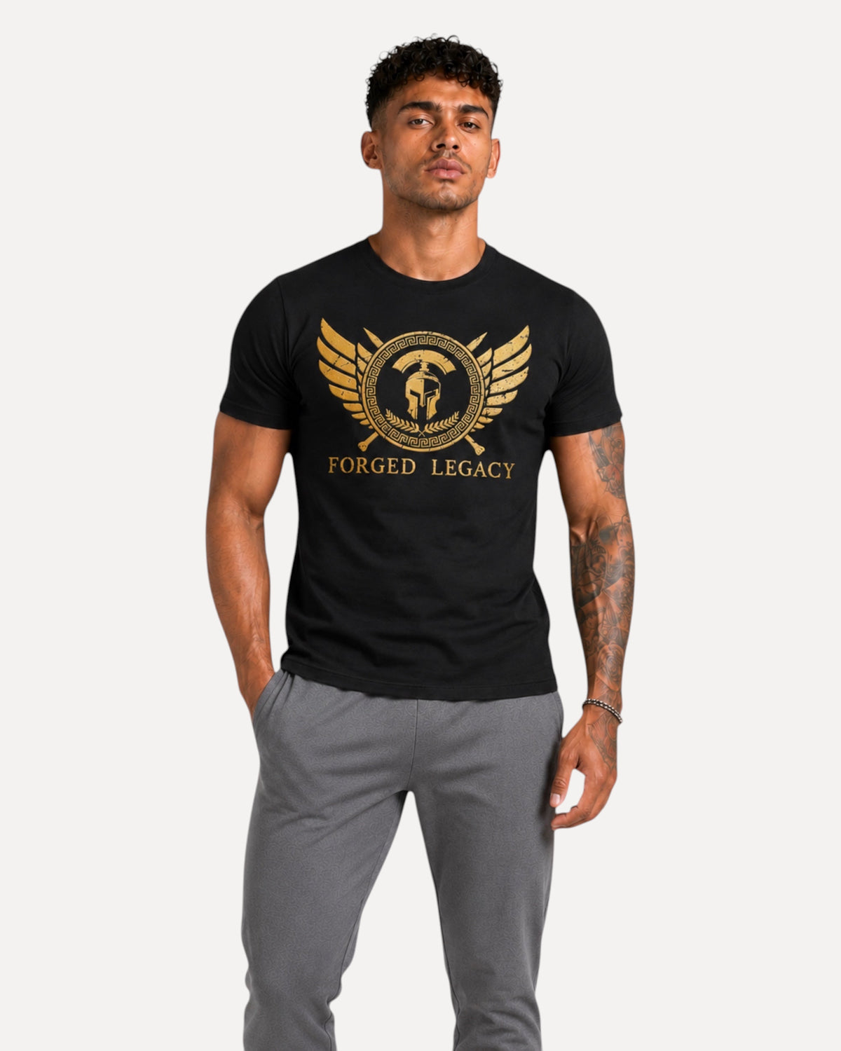 My Store ATHLEX Forged Legacy black cotton t-shirt with gold warrior helmet and wing graphic worn by a male model