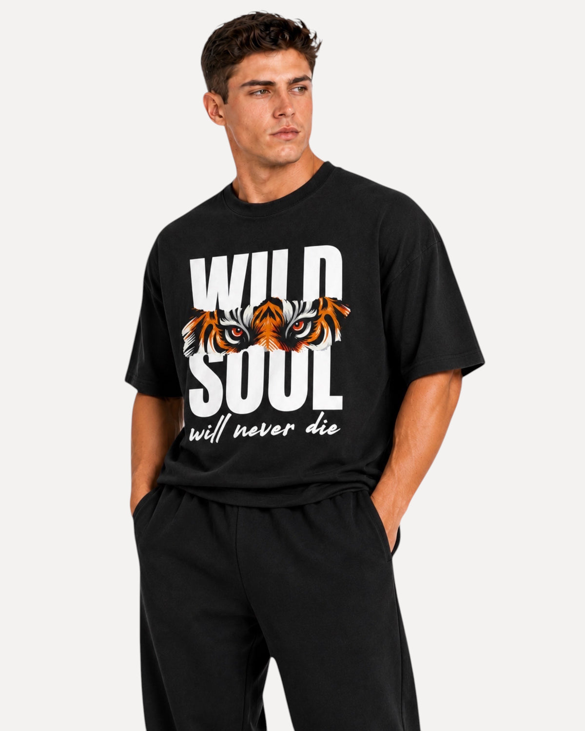 My Store ATHLEX black oversized graphic tee featuring a tiger eye print and Wild Soul text on a male model