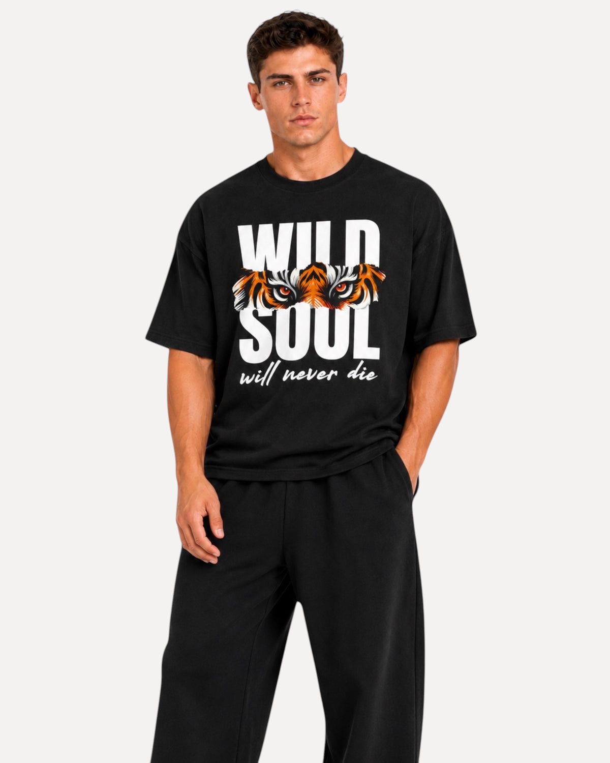 My Store ATHLEX Wild Soul black oversized graphic tee with tiger eye print worn by a male model