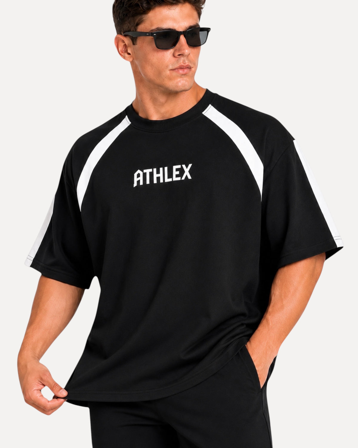 My Store ATHLEX black oversized performance t-shirt with white shoulder panels and logo on a male model wearing shades