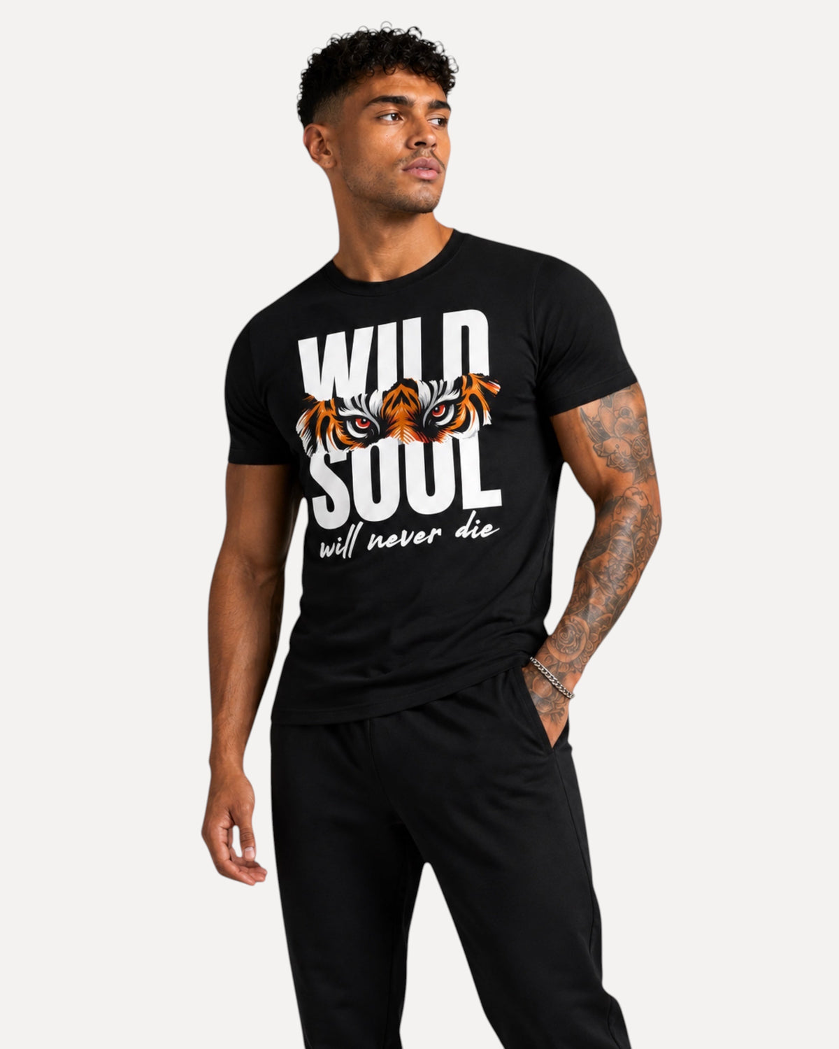 My Store ATHLEX black cotton graphic tee featuring a tiger eye Wild Soul print worn by a tattooed male model