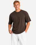 My Store Athlex oversized chocolate brown t-shirt worn by a man with white shorts for a relaxed streetwear look