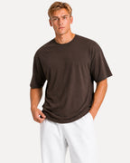 My Store Athlex oversized chocolate brown t-shirt worn by a man with white shorts for a relaxed streetwear look