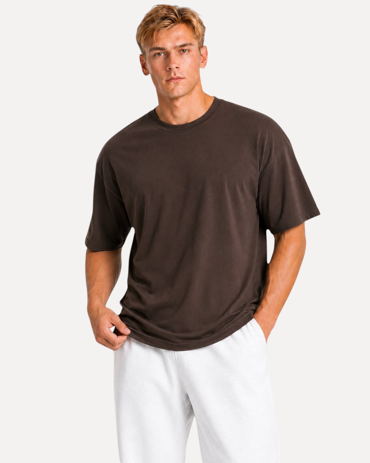 My Store Athlex oversized chocolate brown t-shirt worn by a man with white shorts for a relaxed streetwear look