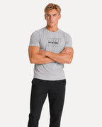 My Store ATHLEX grey athletic fit cotton t-shirt with Run For The Thrill graphic worn by a man with arms crossed