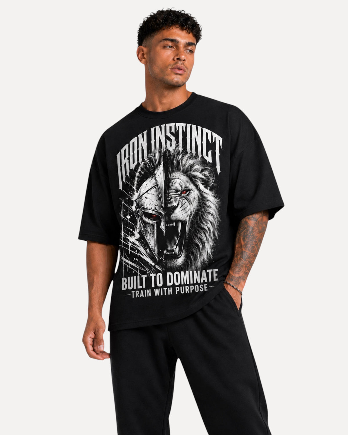 My Store Athlex Iron Instinct oversized black graphic t-shirt with lion and warrior helmet print on a male model