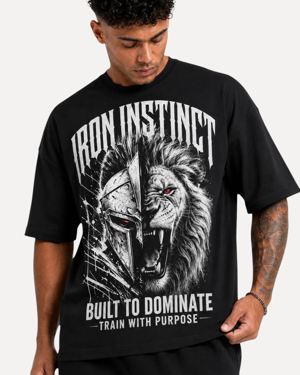 My Store Athlex Iron Instinct black oversized graphic t-shirt featuring a warrior helmet and lion design on a man.