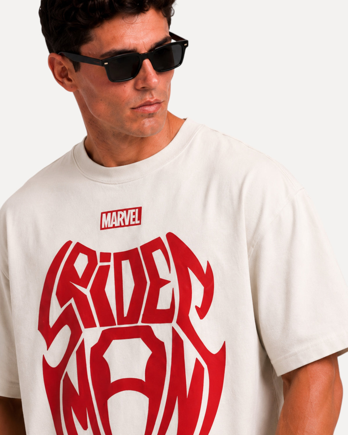 My Store ATHLEX off-white oversized cotton t-shirt with bold red Spider-Man graphic worn by a man in sunglasses
