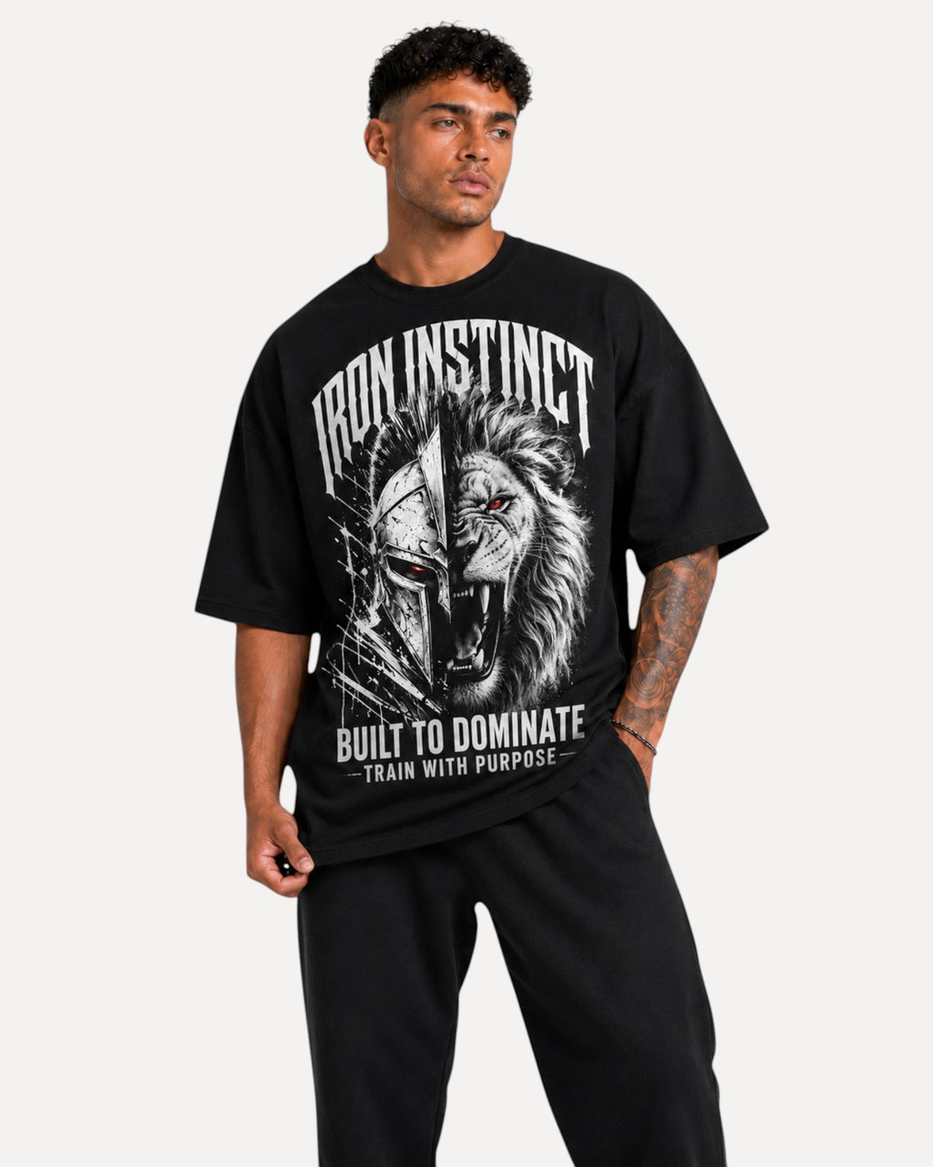 My Store Athlex Iron Instinct oversized black graphic t-shirt featuring a lion and warrior helmet on a male model