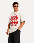 My Store ATHLEX off-white oversized cotton t-shirt featuring a bold red Spider-Man graphic worn by a male model.